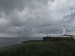 SX06651 Dark clouds over Nash Point lighthouse.jpg